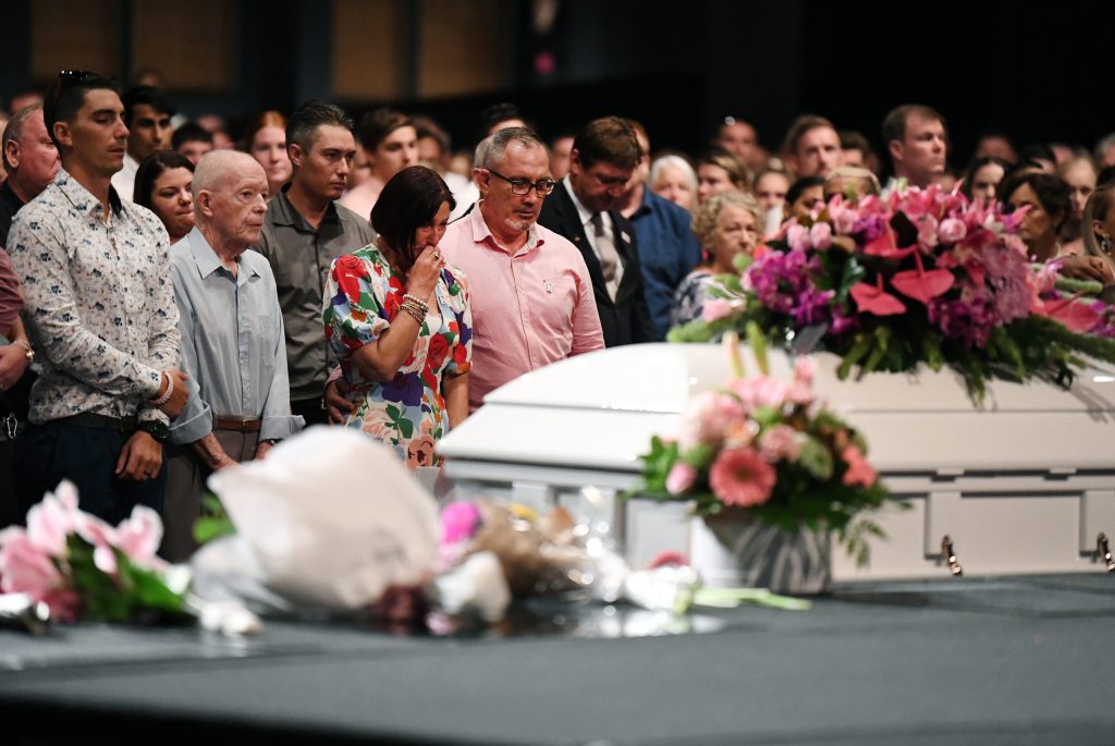 Family and friends mourn Hannah Clarke and her children Aaliyah, Laianah and Trey at their funeral in March 2020. Hannah and her children were murdered by their estranged husband and father. (Photo: AAP Image/Dan Peled) 