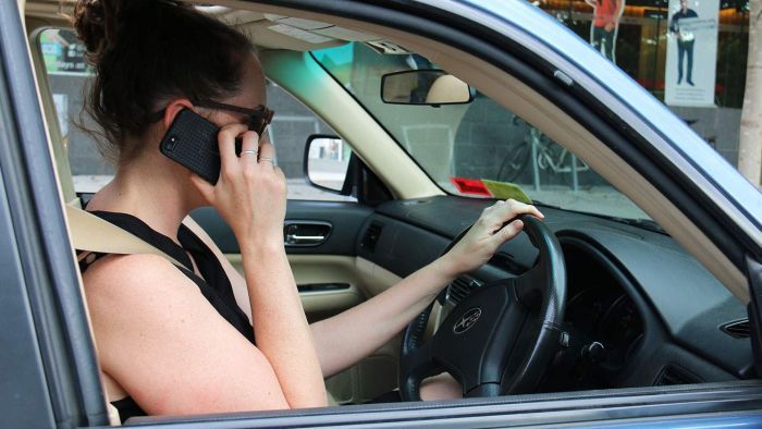 Police say the new penalties reflect the danger posed by using a mobile phone while driving. Photo: ABC