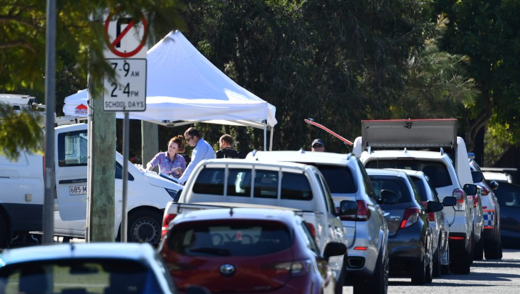 Police are seen at a crime scene where the body of a four-year-old girl was found at a house in Cannon Hill in Brisbane Monday, May 25, 2020. Police have established a crime scene at the Bent Street home (AAP Image/Darren England)