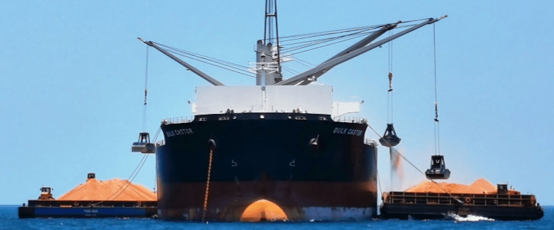 Barges load a ship from Metro's Cape York bauxite mine (Image: Metro Mining)