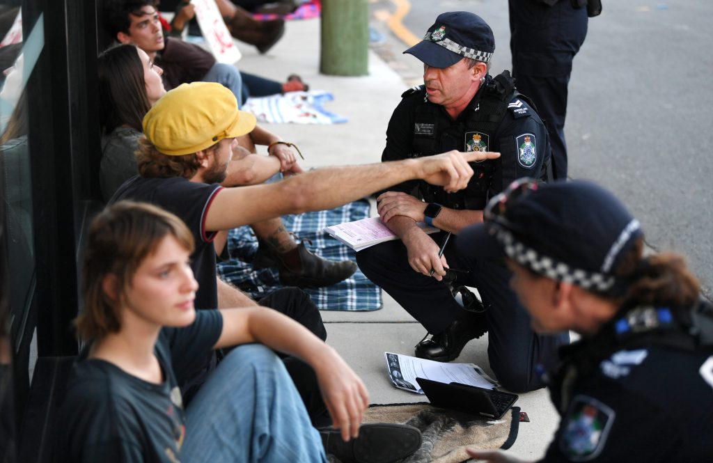 Thumbnail for Protesters blockade Brisbane street after night of violence at asylum-seeker hotel