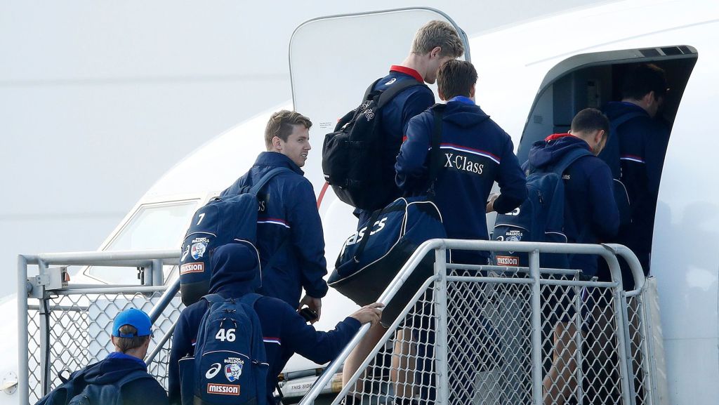 Western Bulldogs players board a flight for the Gold Coast on Monday. (Photo: AFL Photos)
