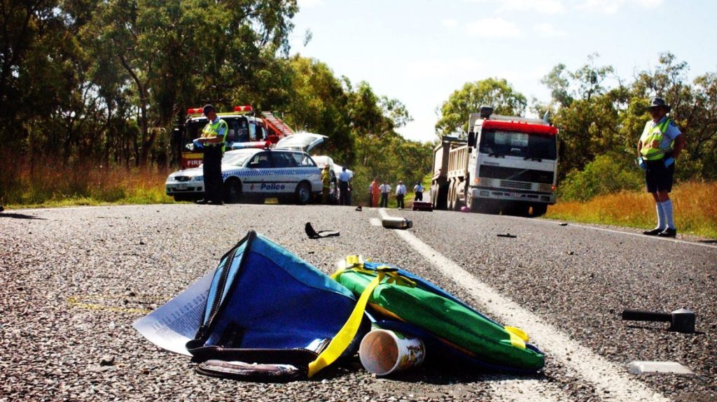 Debris lies scattered across the Bruce Highway near Gladstone 500km after a serious collision on the two-lane section of our national highway.
(AAP Image) 