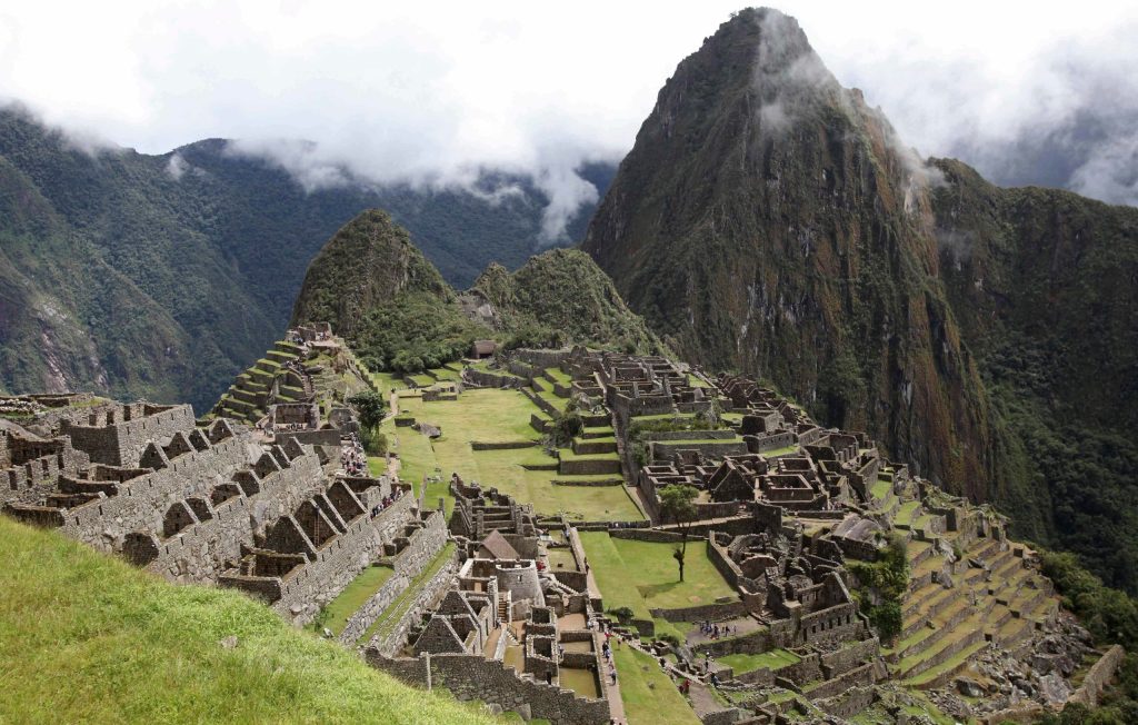 Japanese tourist Jesse Takayama is the fist tourist to have visited Machu Picchu in seven months. (Photo: AP Photo/Karel Navarro)