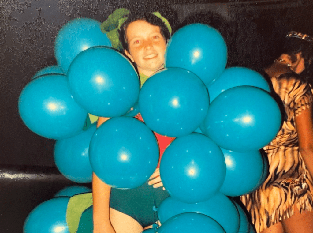 A young Rebecca Levingston in the grip of the grape for Book Week.