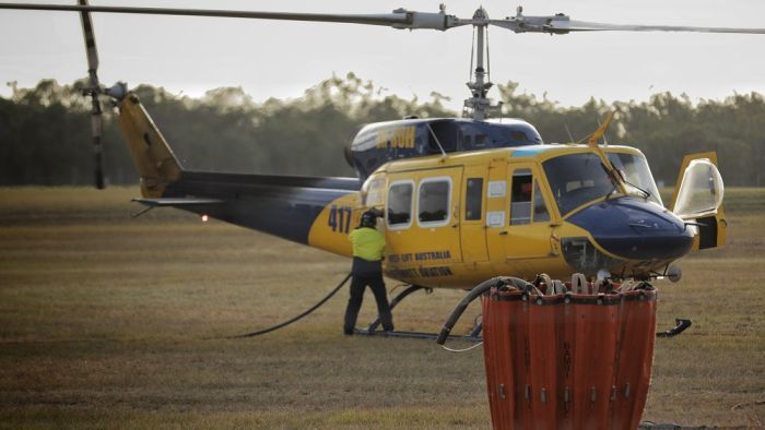 Helilift Australia (McDermott Aviation) water dumping chopper 417 refuels at Hervey Bay Airport to assist with the Fraser Island bushfire. (Photo: ABC)
