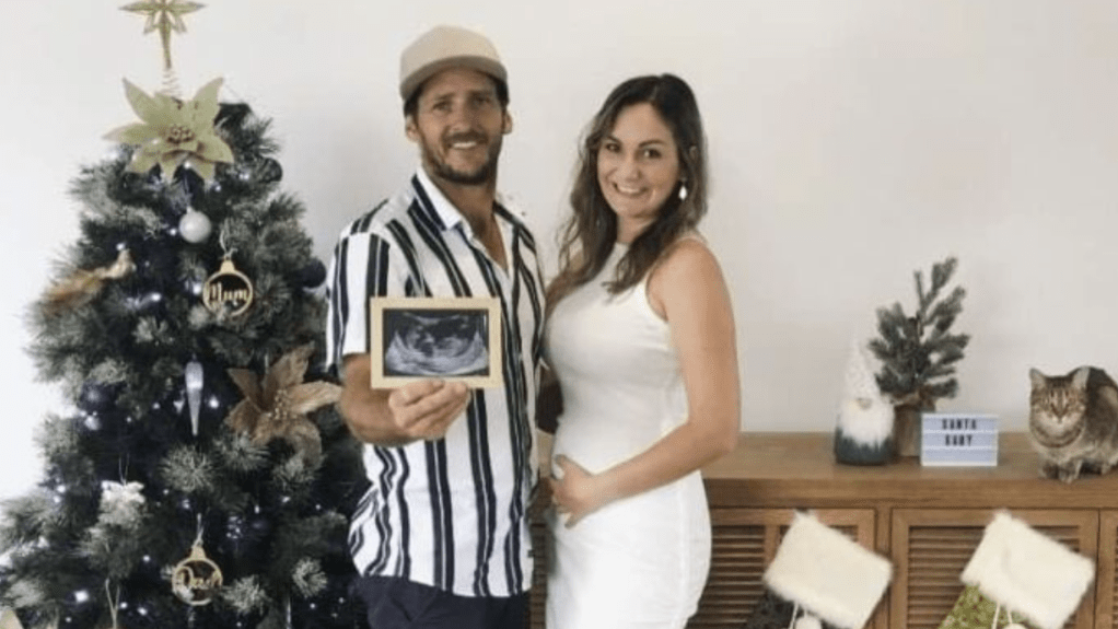 Matt Field and Kate Leadbetter with an ultrasound photo of their unborn baby, Miles. (Photo: Facebook)