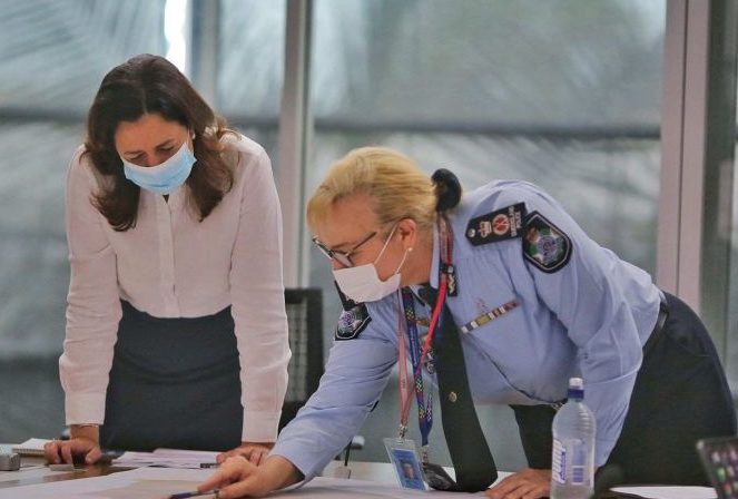 Former Queensland Premier Annastacia Palaszczuk and ex-Queensland Police Commissioner Katarina Carroll wore masks during the Covid pandemic. (Image: AAP)