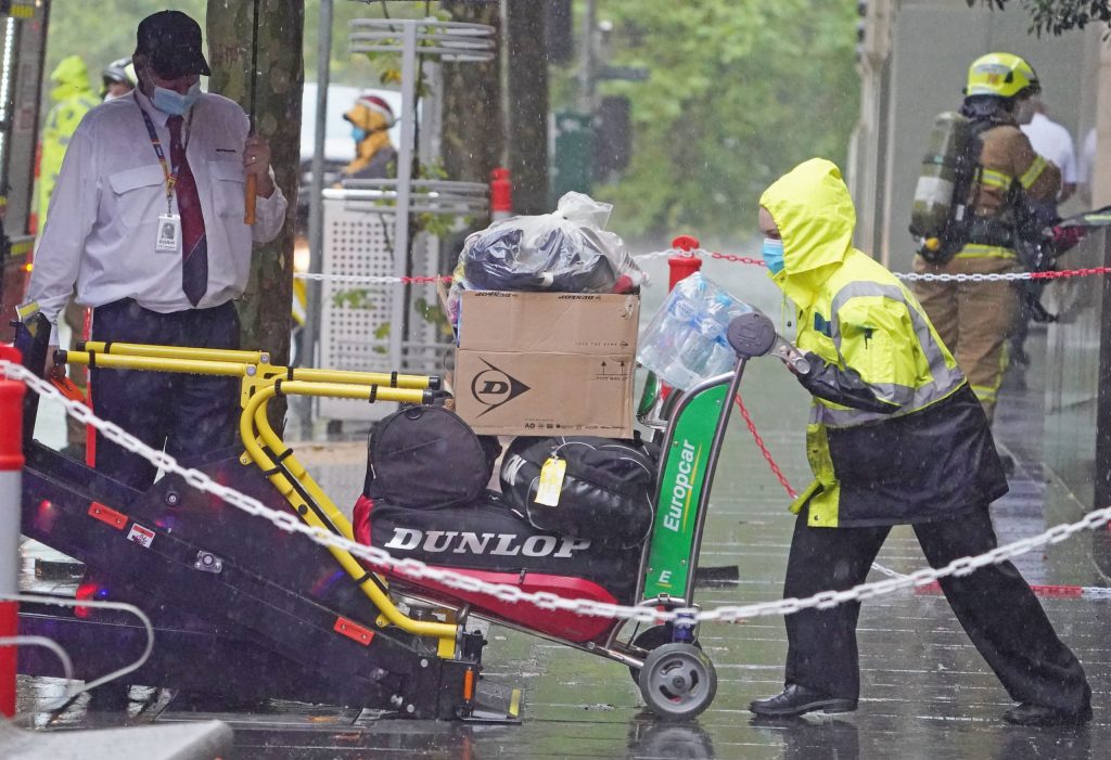 Tennis equipment is loaded on to a bus outside of the Grand Hyatt Melbourne hotel in Melbourne last week after the original quarantine ended. (Photo: AAP Image/Scott Barbour) 