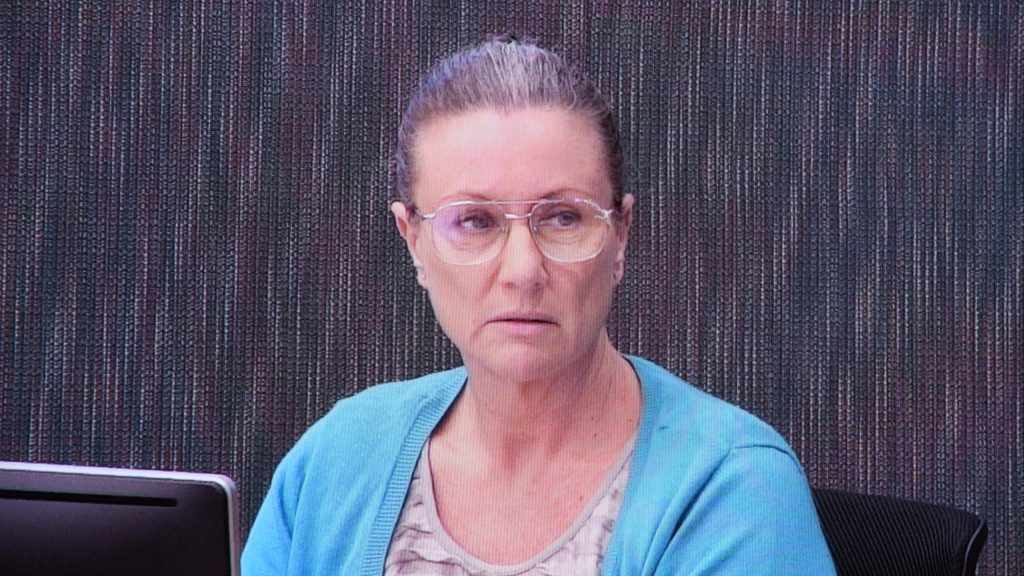 Kathleen Folbigg appears via video link during a convictions inquiry at the NSW Coroners Court in April 2019. The NSW Government will conduct another inquiry into her guilt.  (AAP Image/Peter Rae) 