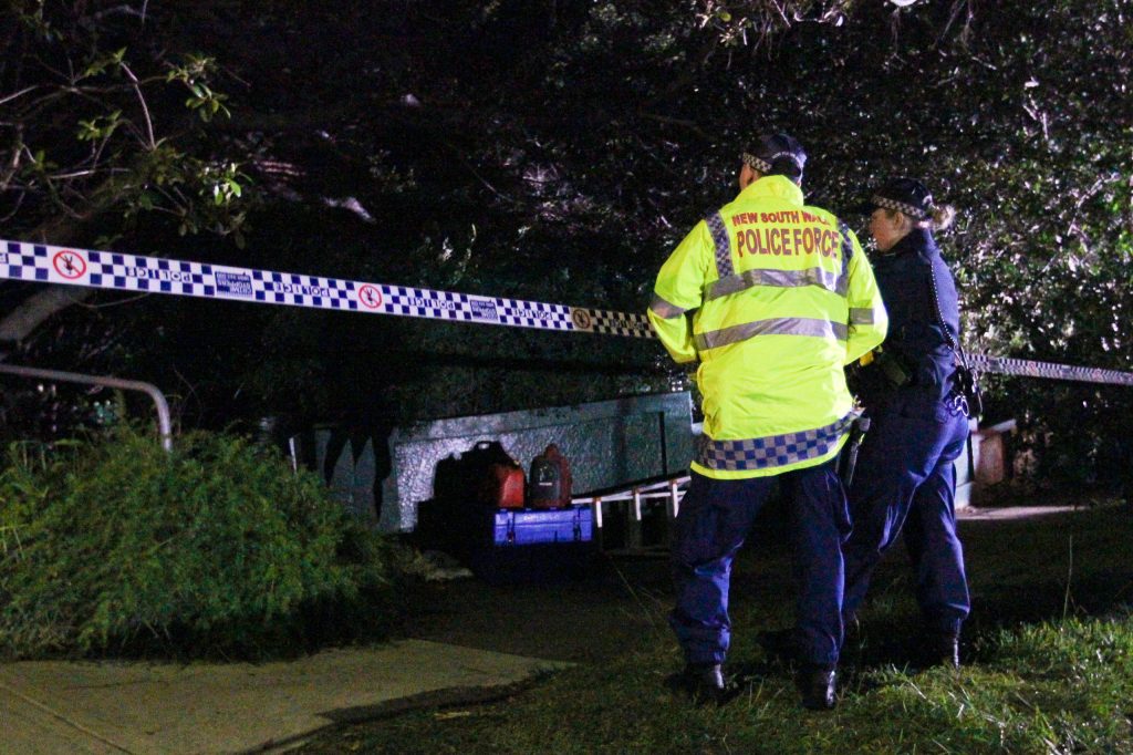 NSW police outside the home of a Sydney recluse who a coroner heard had kept a mummified body of a dead intruder hidden for 15 years. (AAP Image/Danny Casey)