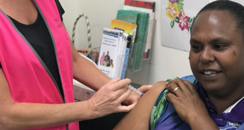 Nurse Immuniser Ruth Ferguson vaccinates Saibai Island school teacher Norah Tabuai in the early phase of the AstraZeneca rollout. (Image: Queensland Health)
