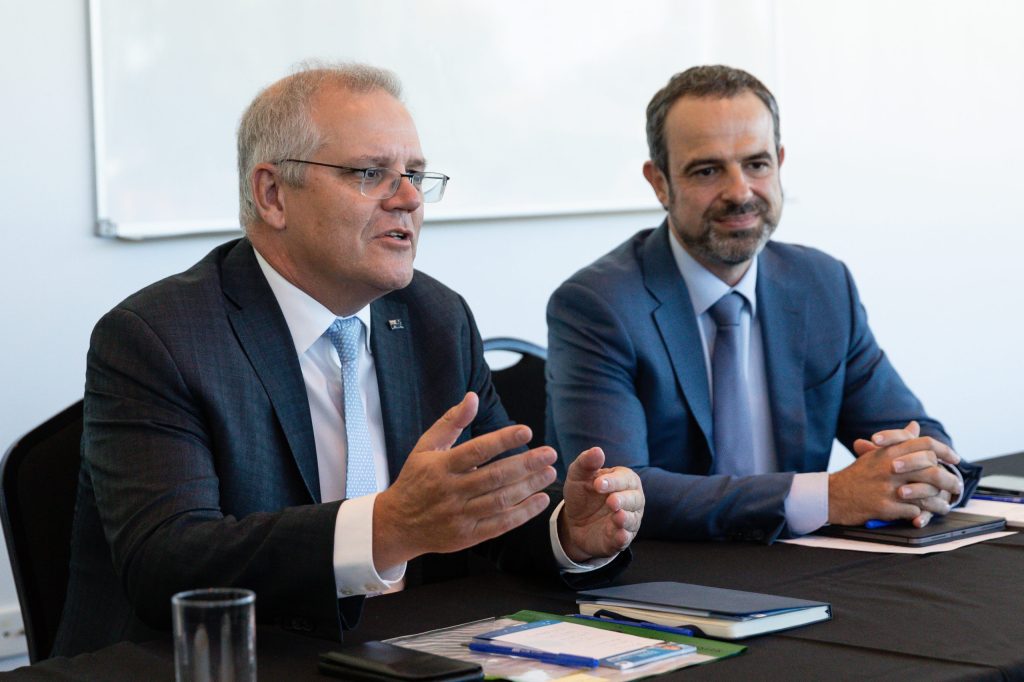 Prime Minister Scott Morrison is seen alongside AMA President, Dr Omar Khorshid during a GP Roundtable meeting in Perth. (AAP Image/Richard Wainwright)