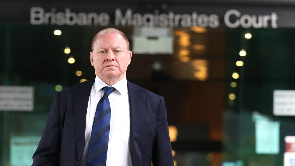 Dennis Watt leaves the Magistrates court in Brisbane after giving evidence at the inquest into the 1973 Whiskey Au Go-Go nightclub fire which claimed the lives of 15 people. (AAP Image/Jono Searle)