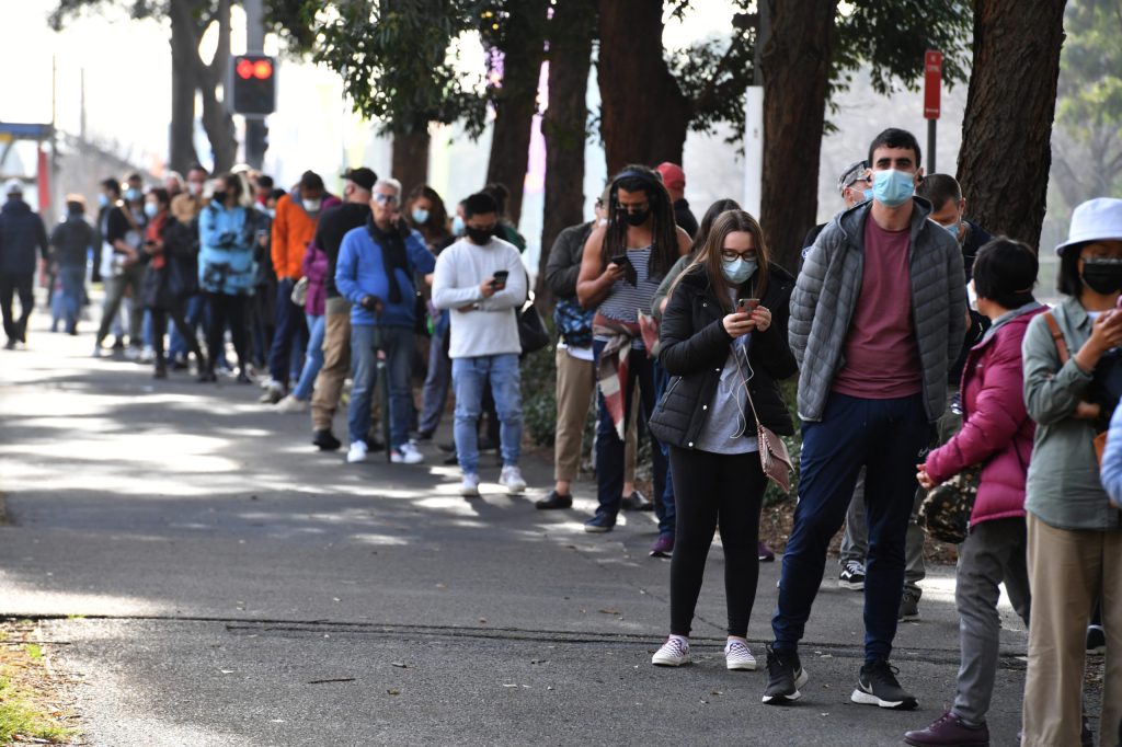 People queuing to receive their vaccination at the NSW Vaccine Centre at Homebush Olympic Park in Sydney,  (AAP Image/Mick Tsikas) 