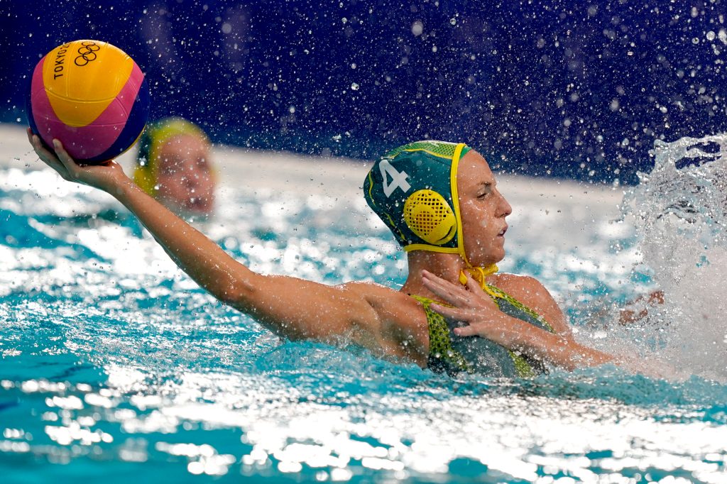 Australia's Bronte Halligan (4) protects the ball from a defender . (AP Photo/Mark Humphrey)