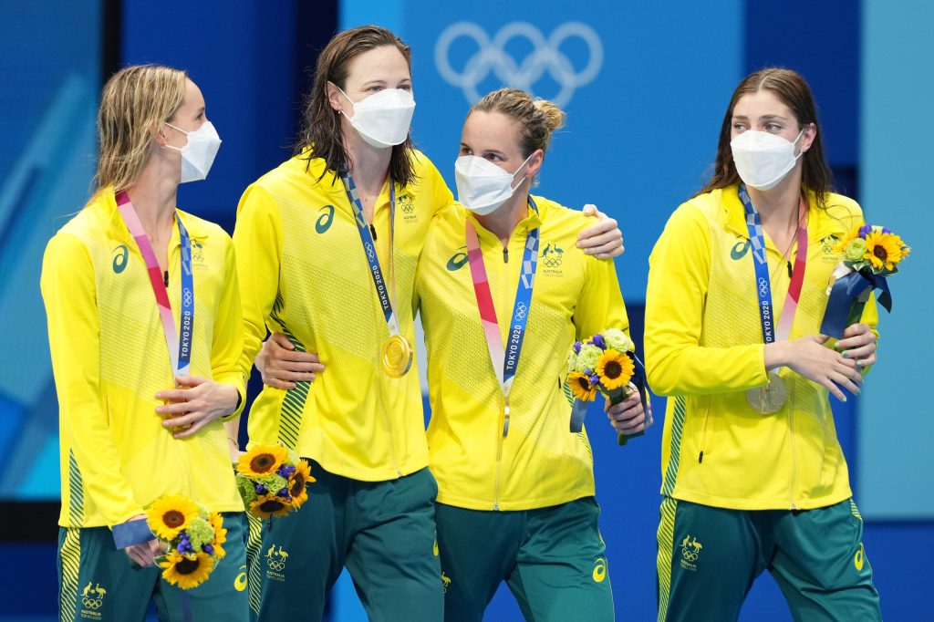 Australia’s 4 x 100m Women’s freestyle team (lt-rt) Emma McKeon, Cate Campbell, Bronte Campbell and Meg Harris with their Gold Medals after winning the Women's 4 x 100m Freestyle Relay final with a world record time at the Tokyo Aquatic Centre during the Tokyo Olympic Games, Sunday, July 25, 2021. (AAP Image/Joe Giddens) NO ARCHIVING, EDITORIAL USE ONLY, IMAGES TO BE USED FOR NEWS REPORTING PURPOSES ONLY, NO COMMERCIAL USE WHATSOEVER, NO USE IN BOOKS WITHOUT PRIOR WRITTEN CONSENT FROM AAP