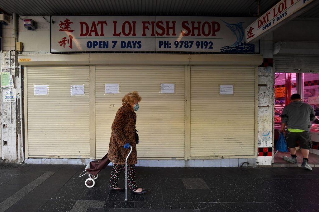 Shoppers wearing face masks on Beamish Street at Campsie in Sydney, Tuesday The Campsie Centre Shopping Mall in Sydney's southwest has been listed as a close contact venue after multiple people with COVID-19 visited the site. (AAP Image/Joel Carrett) 