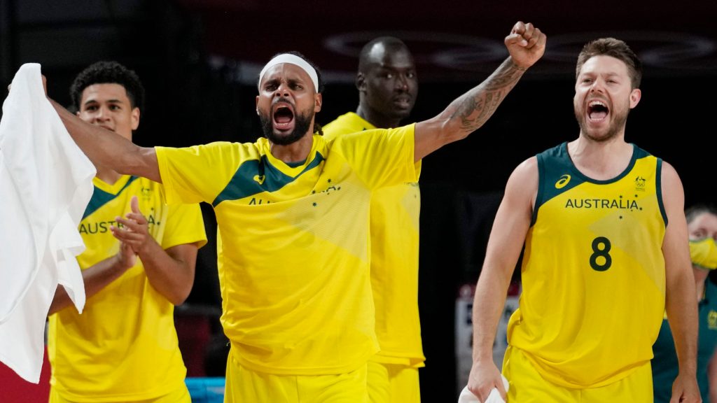 Australia's Patty Mills, left, and Matthew Dellavedova (8) celebrate a score against Argentina during a men's basketball quarterfinal round game. (AP Photo/Eric Gay)