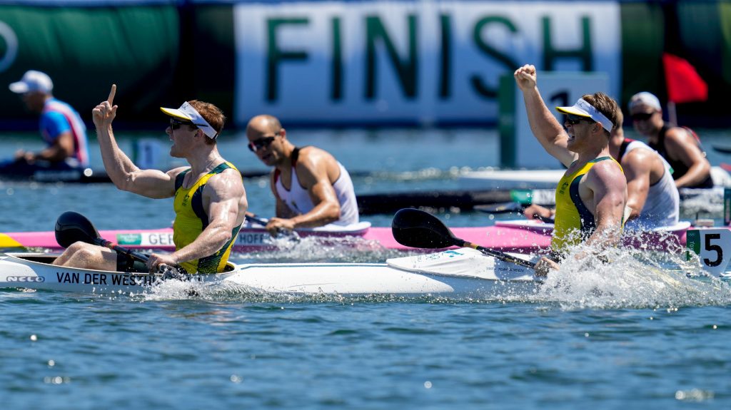 Jean van der Westhuyzen, and Thomas Green, of Australia, celebrate after winning the Toky Olympics men's kayak double 1000m final. (AP Photo/Kirsty Wigglesworth)