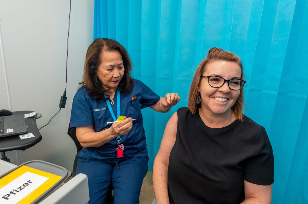 Registered nurse Jane Hunter prepares to vaccinate Moranbah resident Leisa Thiess.
Photo : Daryl Wright