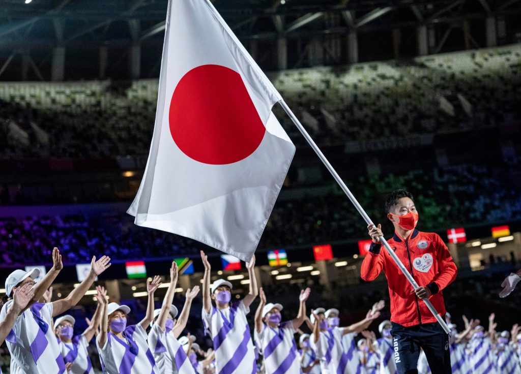 Flag bearer Iwabuchi Koyo of Japan carries the flag into the Olympic Stadium during the closing ceremony of the Tokyo 2020 Paralympic Games on Sunday, Sept. 5. (Thomas Lovelock for OIS via AP)