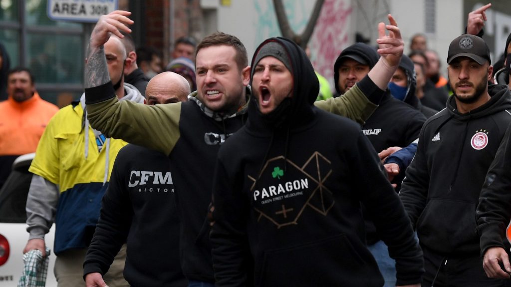 Construction workers at a protest at Construction, Forestry, Maritime, Mining and Energy Union (CFMEU) headquarters in Melbourne. (AAP Image/James Ross)