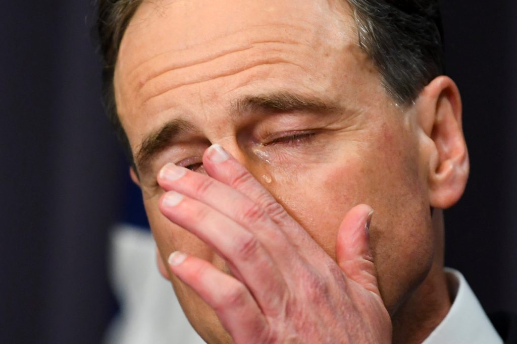 Australian Health Minister Greg Hunt tears up as he speaks about death threats to his family. (AAP Image/Lukas Coch)