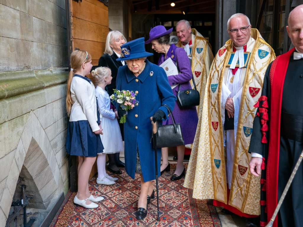 Thumbnail for At 95, stoic Queen uses walking stick for first time at public event