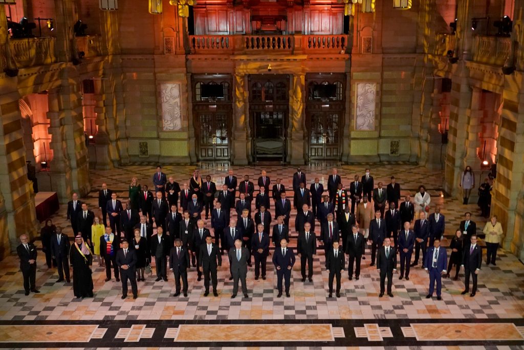 World Leaders pose for a group photo during an evening reception to mark the opening day of the COP26 U.N. Climate Summit, in Glasgow, Scotland, Monday, Nov. 1, 2021. The U.N. climate summit in Glasgow gathers leaders from around the world, in Scotland's biggest city, to lay out their vision for addressing the common challenge of global warming. (AP Photo/Alberto Pezzali, Pool)