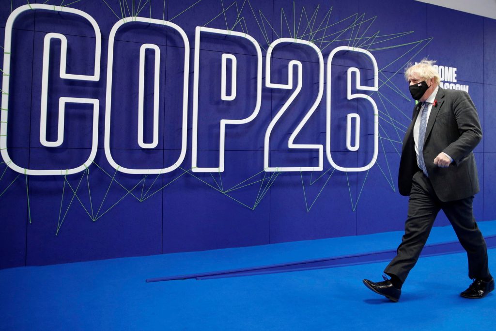 British Prime Minister Boris Johnson arrives at the Cop26 summit at the Scottish Event Campus (SEC) in Glasgow, Wednesday, Nov. 10, 2021. The U.N. climate summit in Glasgow has entered its second week as leaders from around the world, are gathering in Scotland's biggest city, to lay out their vision for addressing the common challenge of global warming. (Phil Noble, Pool via AP)