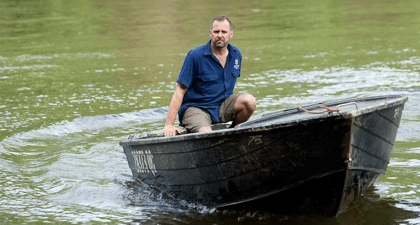 Professor Craig Franklin keeps an eye out for crocodiles on the Wenlock River, north of Weipa.