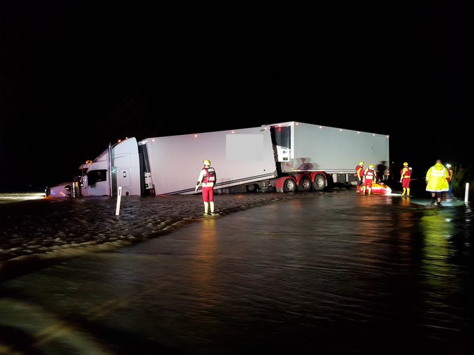 Swift water rescue teams in action saving a truckie from floodwaters in Goondiwindi early this morning. More rain expected across most of Queensland today. Photo: Twitter.
