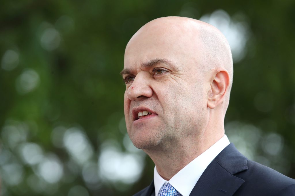 Queensland Chief Health Officer Dr John Gerrard says the government is planning for more waves of the pandemic over winter. (AAP Image/Jono Searle)