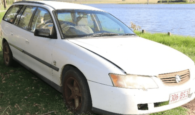The vehicle owned by Darryl Smith, found near a dam where two bodies were discovered chained together. (Photo: Supplied QPS)