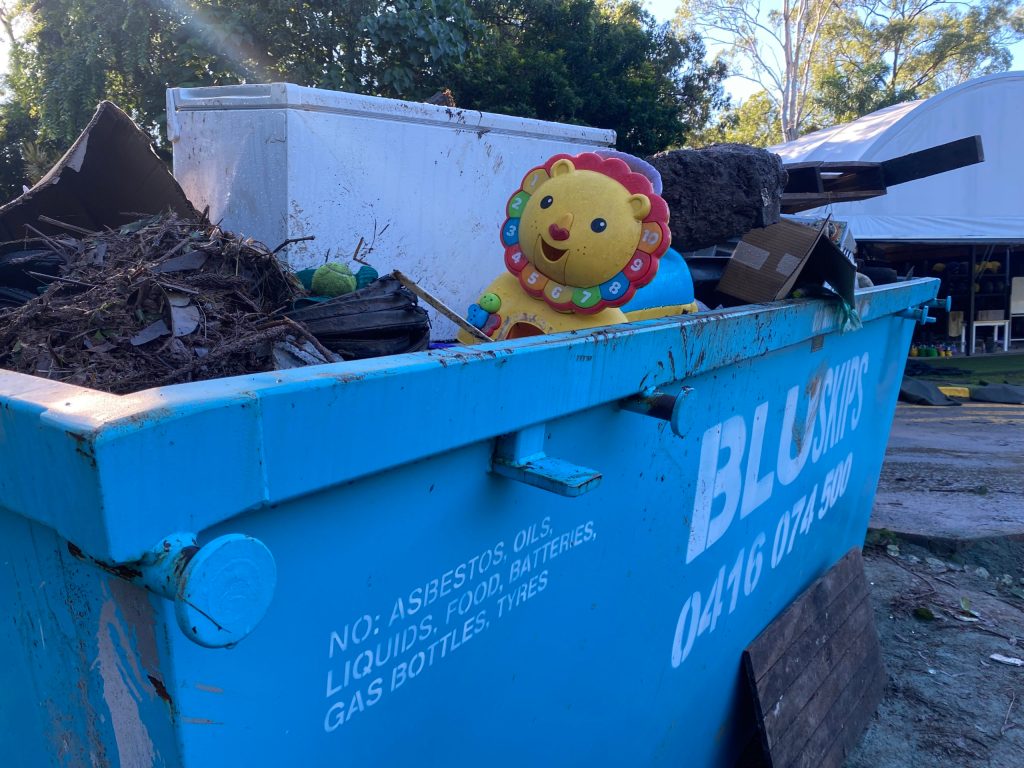 The smile of a child's toy brought a brief respite from the suffocating muck that surrounds it. Image: Rebecca Levingston