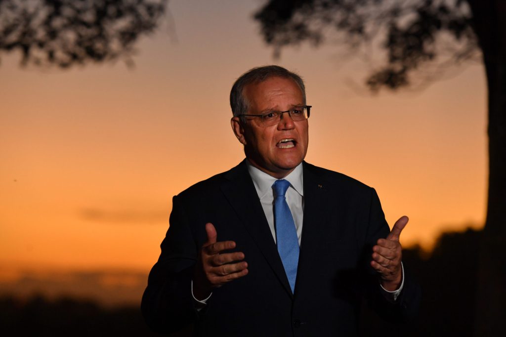 Prime Minister Scott Morrison is interviewed by television at Shoalhaven Heads in the Division of Gilmore on the NSW South Coast. (AAP Image/Mick Tsikas)