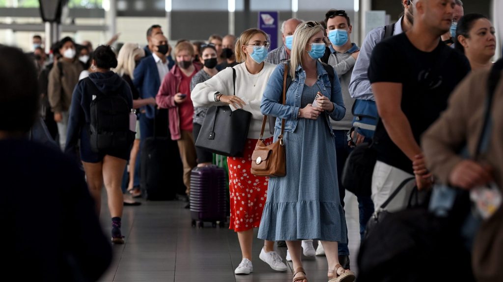 Queues of people are seen at the Virgin and Jetstar departure terminal at at Sydney Domestic Airport. The airlines were among those worst hit by a software outage on Friday (AAP Image/Bianca De Marchi)