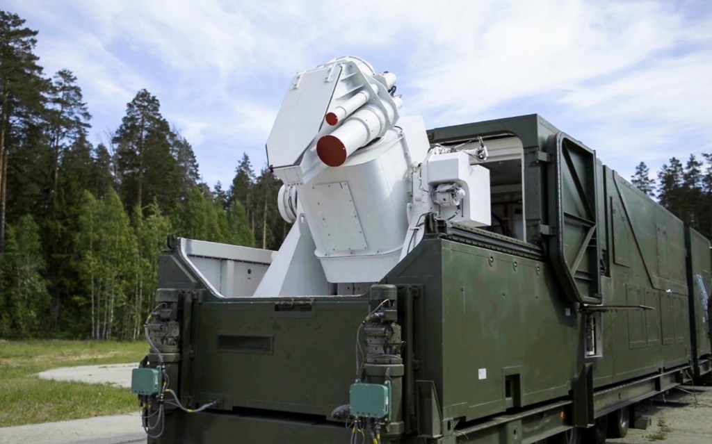 A Russian military truck with a laser weapon mounted on it is shown at an undisclosed location in Russia.  (RU-RTR Russian Television via AP)