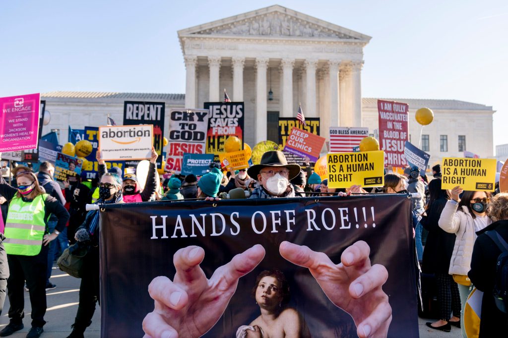 Anti-abortion protesters demonstrate in front of the U.S. Supreme Court as the court hears arguments in a case from Mississippi, where a 2018 law would ban abortions after 15 weeks of pregnancy, well before viability. The historic 1973 Supreme Court ruling establishing a nationwide right to abortion — has been overturned, according to reports. (AP Photo/Andrew Harnik, File)