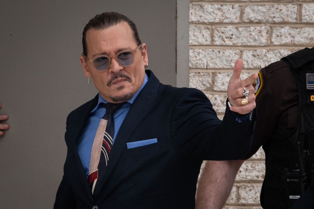 Johnny Depp waves to fans at the Fairfax County Courthouse, in Fairfax, during a break in his civil trial over accusations of domestic violence against ex-wife Amber Heard that he claims defamed him. Photo by Cliff Owen/CNP/ABACAPRESS.COM.
