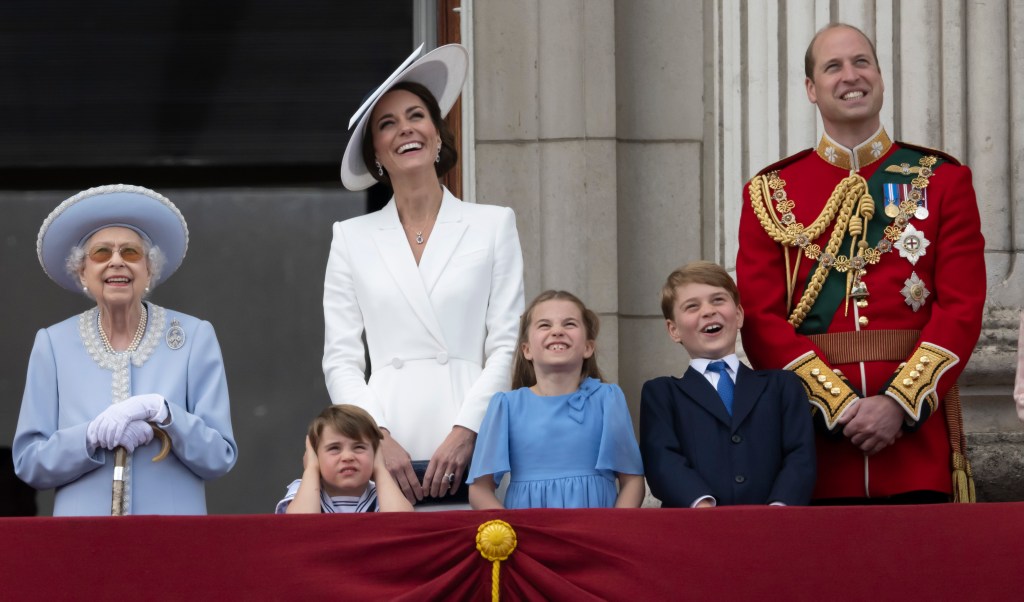 Queen Elizabeth II, Prince Louis, Kate, Duchess of Cambridge, Princess Charlotte, Prince George and Prince William gather on the balcony of Buckingham Palace as they watch a flypast of Royal Air Force aircraft. (Paul Grover, Pool Photo via AP)