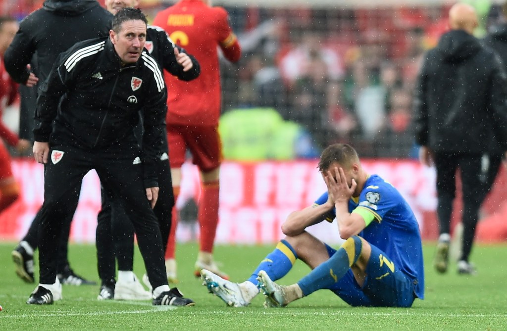 Ukraine's Andriy Yarmolenko (bottom) reacts after the FIFA World Cup 2022 qualification playoff final soccer match between Wales and Ukraine in Cardiff, Wales. EPA/Peter Powell