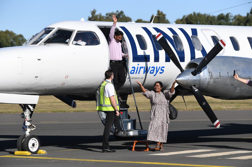Priya and Nades Nadesalingam and their daughters Kopika and Tharnicaa arriving at Thangool Airport. (AAP Image/Darren England) 
