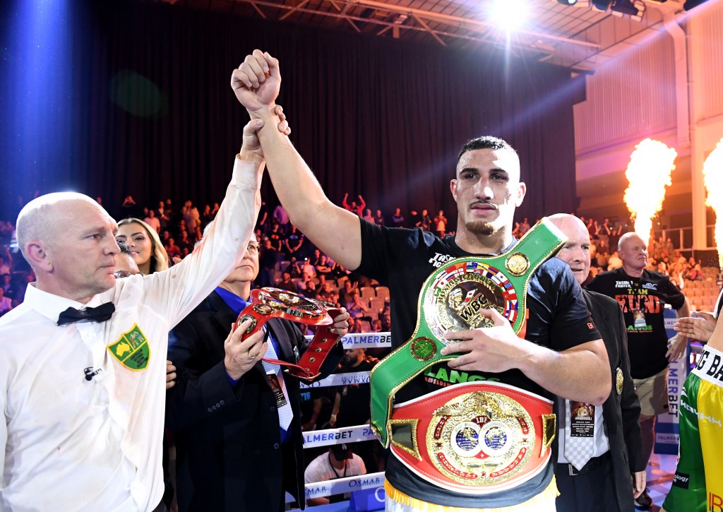 Justis Huni (right) celebrates winning against Joe Goodall for the WBO Oriental and IBF Pan-Pacific titles at Nissan Arena in Brisbane. (AAP Image/Darren England) 
