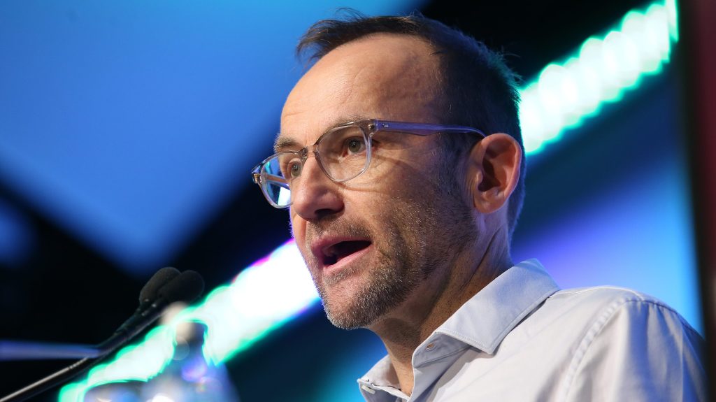 Greens leader Adam Bandt addresses the Queensland Media Club in Brisbane. (AAP Image/Jono Searle) 