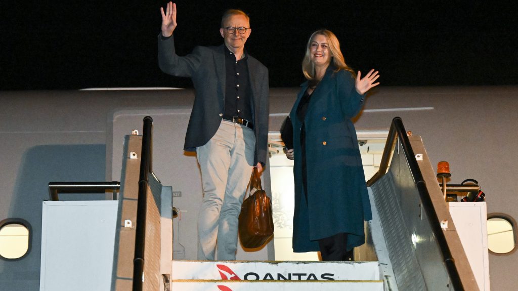 Prime Minister Anthony Albanese and partner Jodie Haydon pictured in 2022 on their way to the NATO leaders summit in Spain. He has opted to skip this year's summit. (AAP Image/Lukas Coch) 