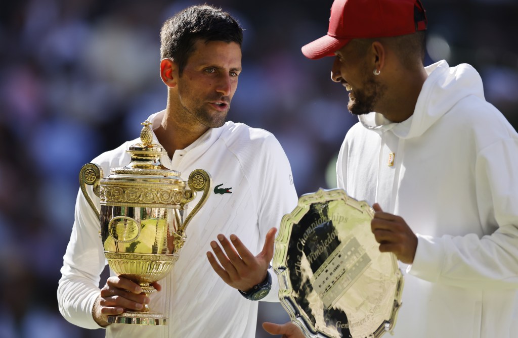 epa10064062 Winner Novak Djokovic (L) of Serbia and runner-up Nick Kyrgios of Australia during the award ceremony after their men's final match at the Wimbledon Championships, in Wimbledon, Britain, 10 July 2022.  EPA/TOLGA AKMEN   EDITORIAL USE ONLY
