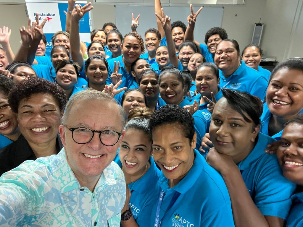 Prime Minister Anthony Albanese poses with some workers in Suva preparing to ease the skills shortage in aged care in Australia. (Supplied image)