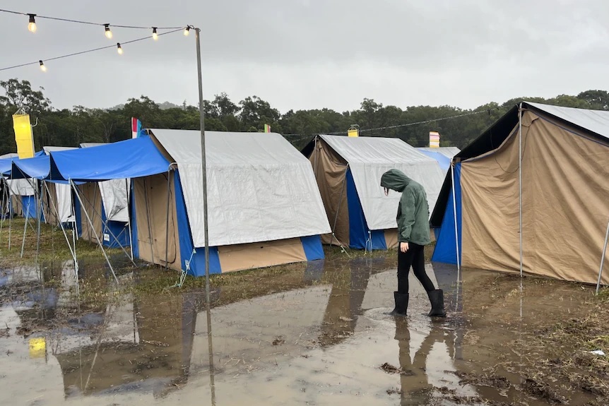 Thumbnail for One dead, music festival chaos in wet, wild and windy weather outlook